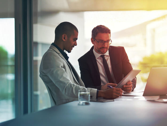two men in a meeting room